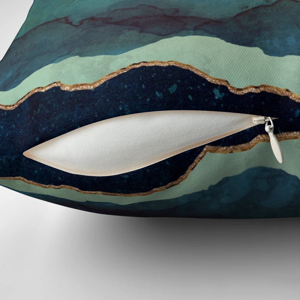 Indigo Mountain Landscape Pillow featuring a contemporary watercolor design of mountains, birds, and a blue and gold color palette.