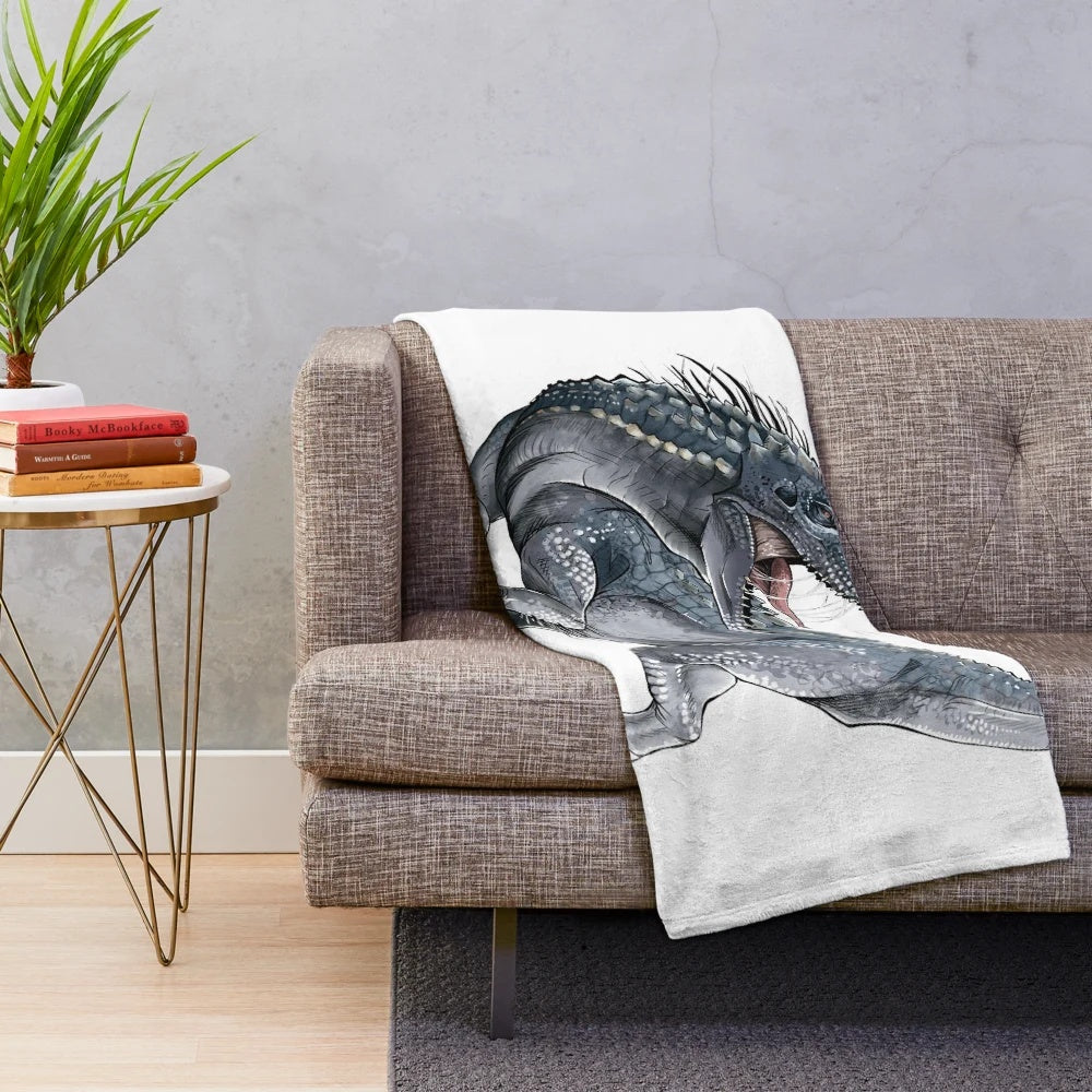 Indominus Rex-inspired plush blanket featuring the iconic dinosaur from Jurassic Park/World franchise