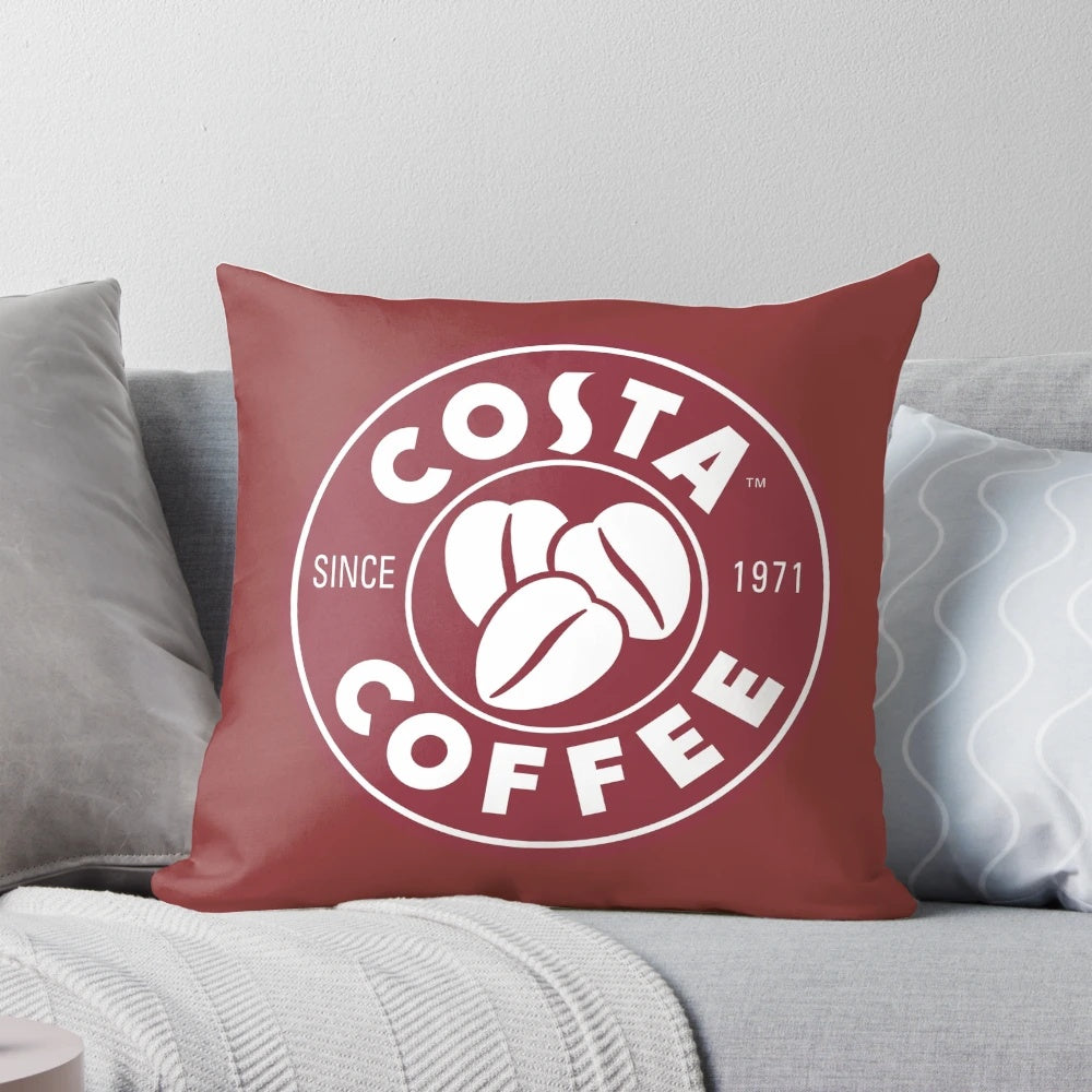 Soft and cozy pillow featuring the iconic Costa Coffee branding