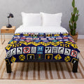 Road signs and traffic regulation symbols printed on a soft, plush blanket