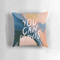 A plush, decorative pillow featuring an abstract art design and an inspiring, motivational quote.