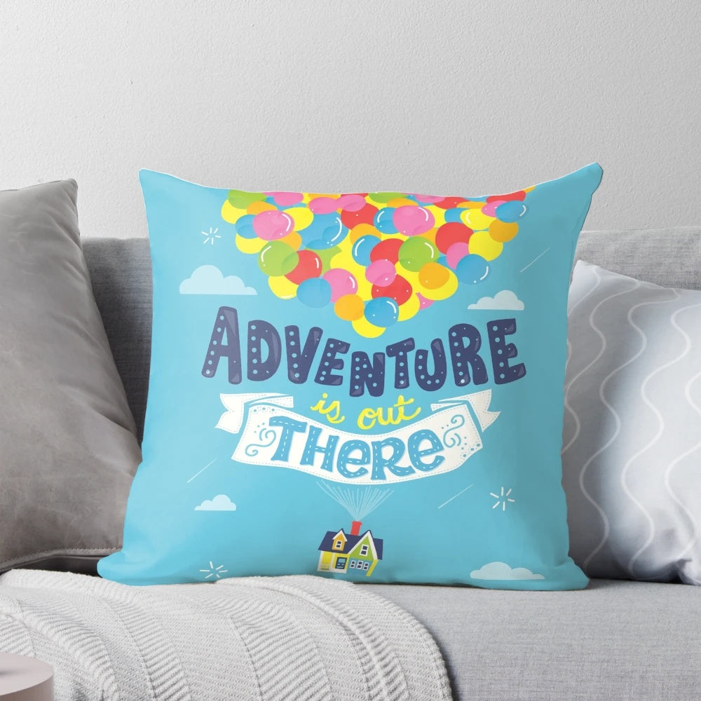 Decorative throw pillow with "Adventure is Out There" quote, perfect for travel-themed home decor