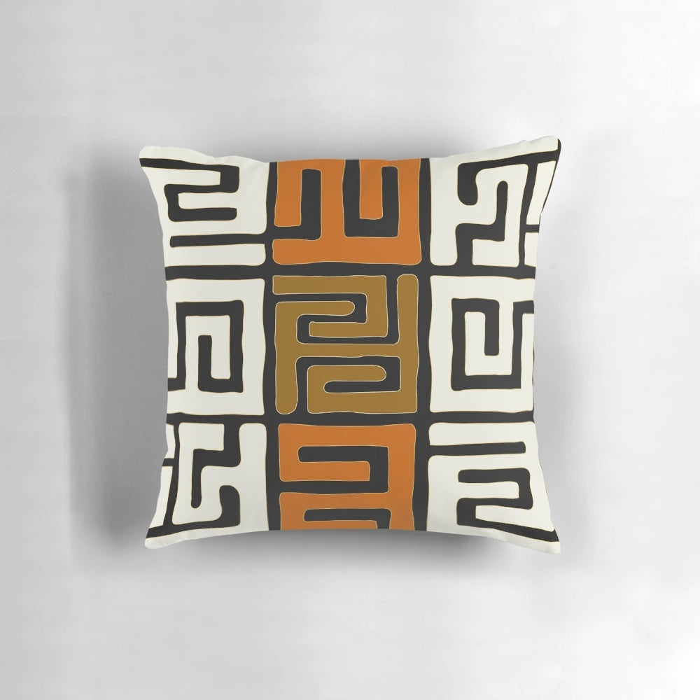 Decorative cream and auburn patterned pillow inspired by African Kuba fabric designs