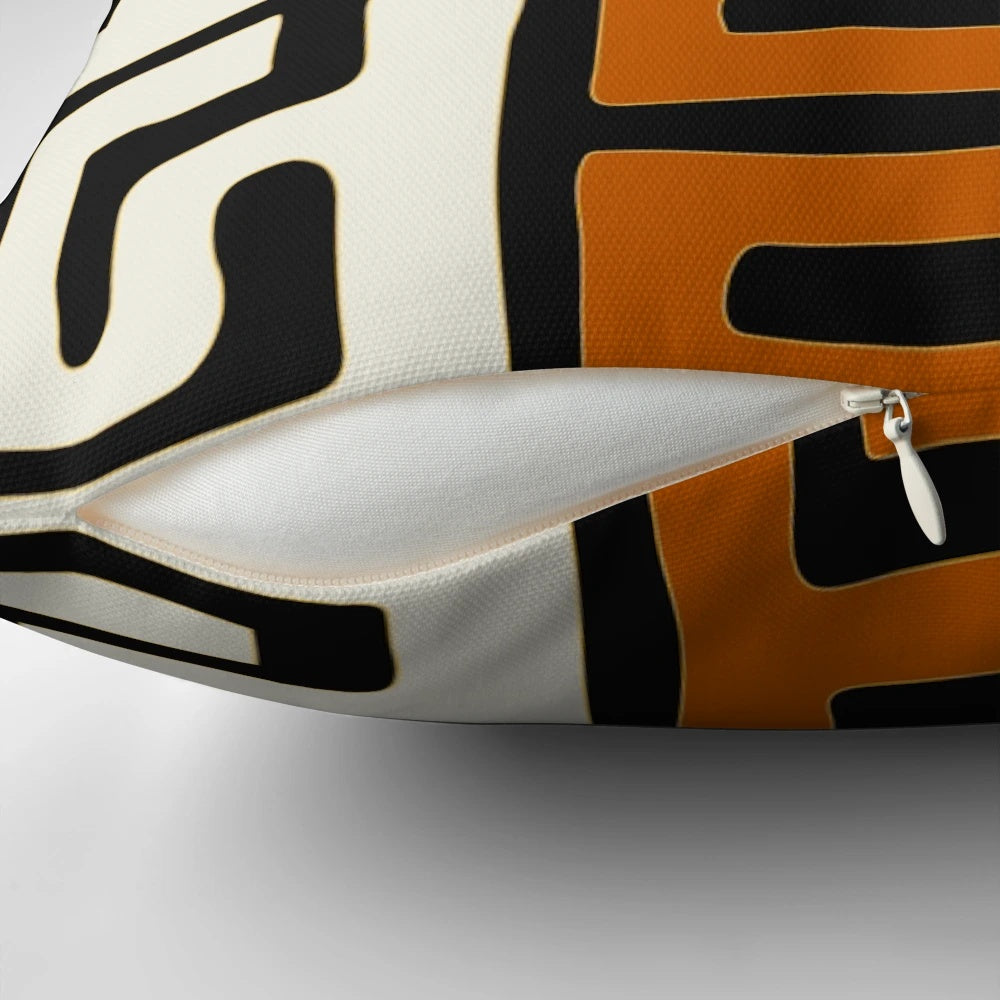 Decorative cream and auburn patterned pillow inspired by African Kuba fabric designs