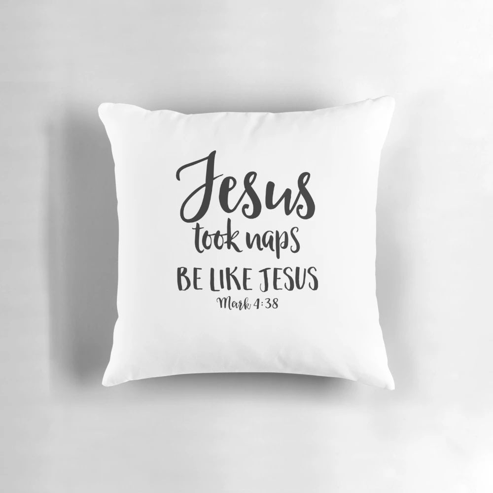 White throw pillow with the text "Jesus Took Naps Be Like Jesus" in a fun, hand-lettered style