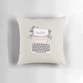 A white throw pillow with black text that says "Don't Stop" in a vintage typewriter font, surrounded by floral patterns.