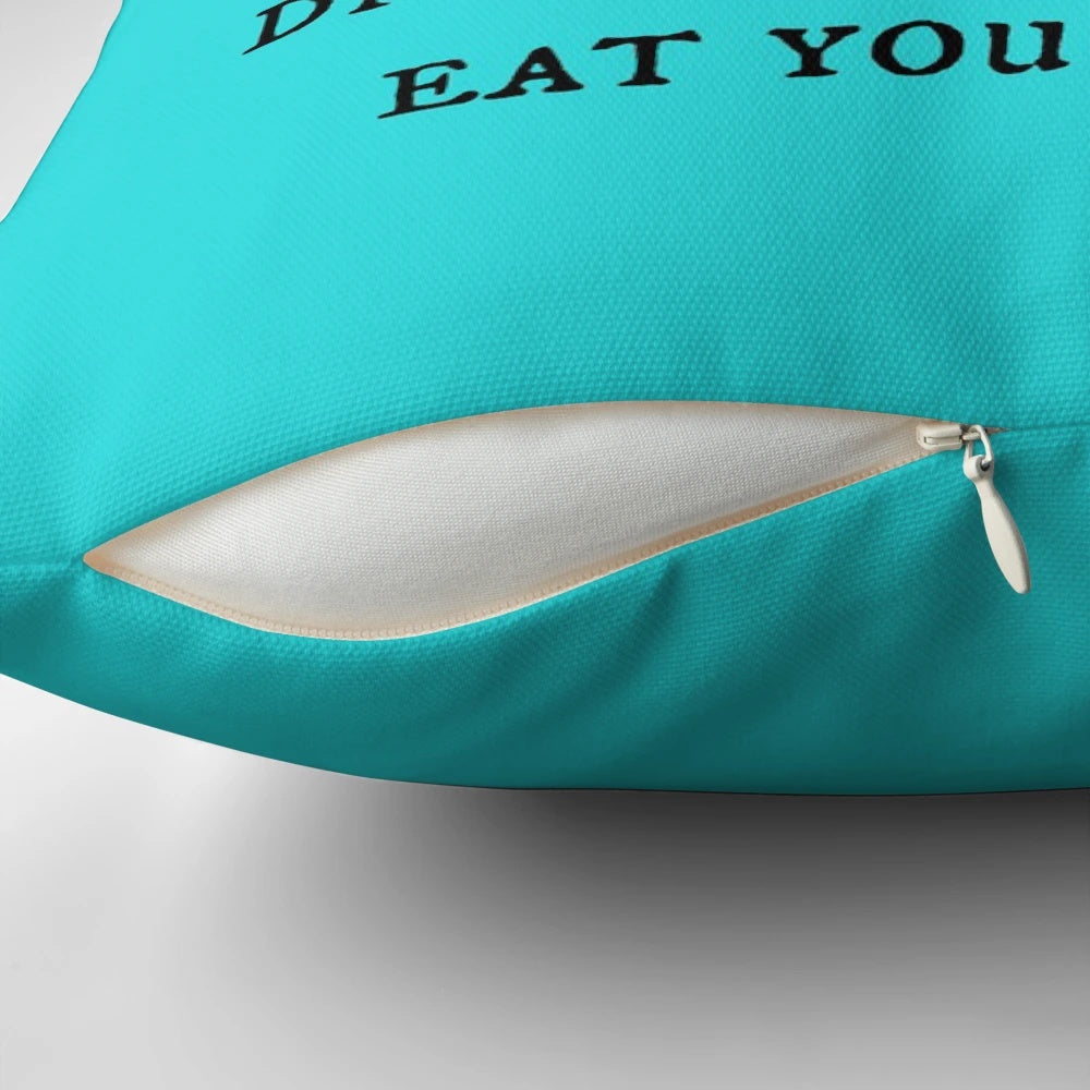 A decorative throw pillow featuring a dragon and motivational feminist quote