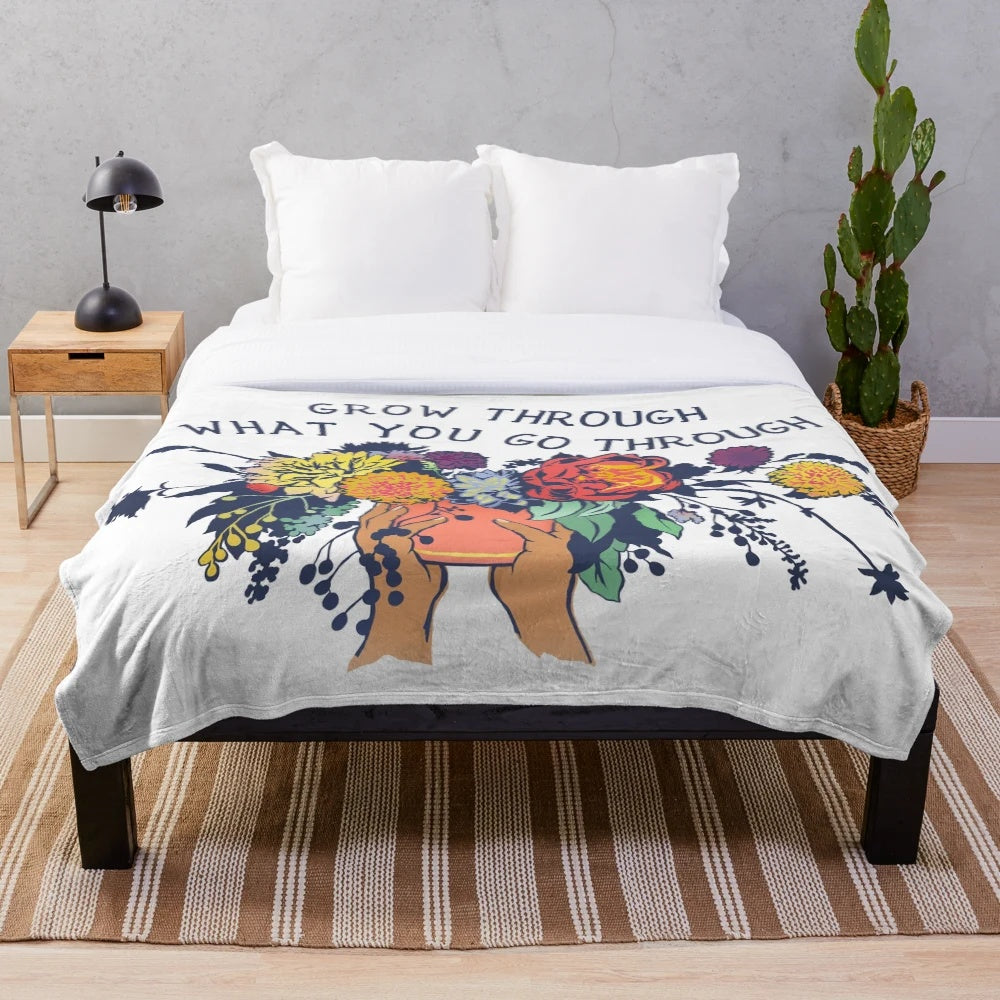Plush blanket with floral design and inspirational quote
