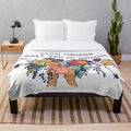 Plush blanket with floral design and inspirational quote