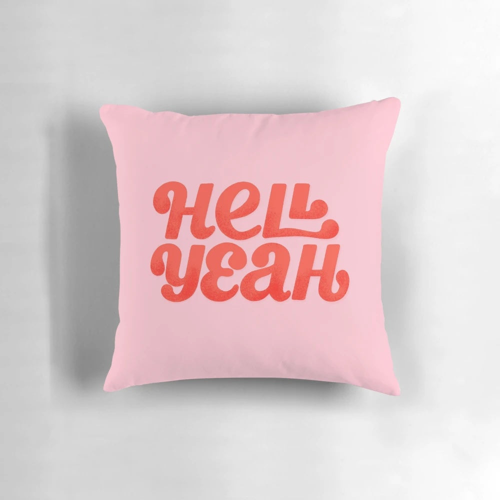 Hell Yeah" pillow with bold, fiery red and pink typography