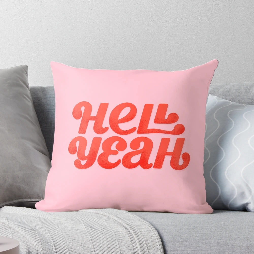 Hell Yeah" pillow with bold, fiery red and pink typography