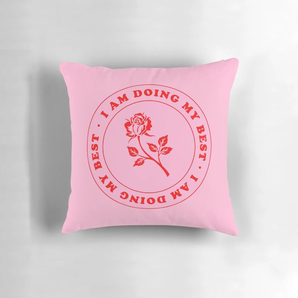 Inspirational pillow with the text 'I Am Doing My Best' in pink and red lettering on a rose-colored background