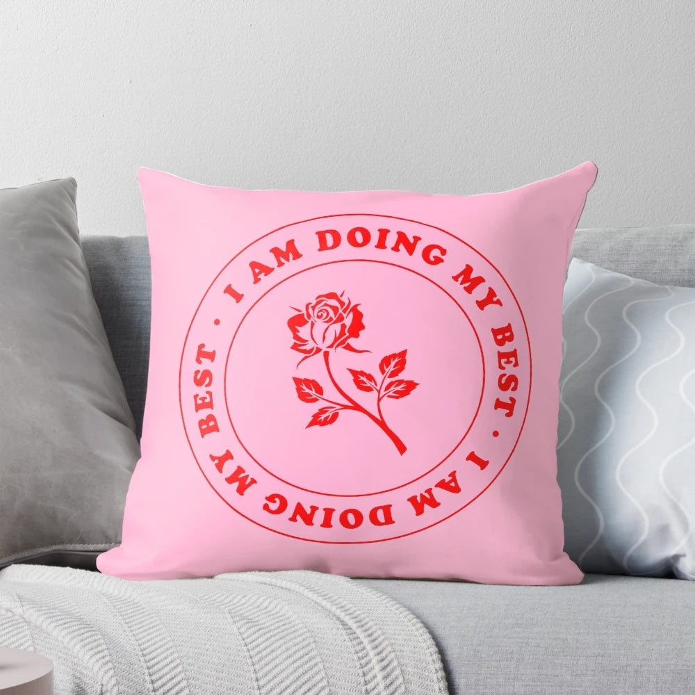Inspirational pillow with the text 'I Am Doing My Best' in pink and red lettering on a rose-colored background