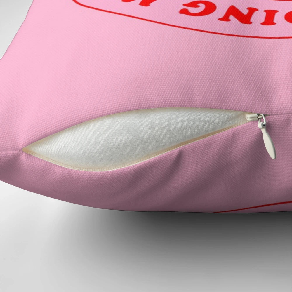 Inspirational pillow with the text 'I Am Doing My Best' in pink and red lettering on a rose-colored background