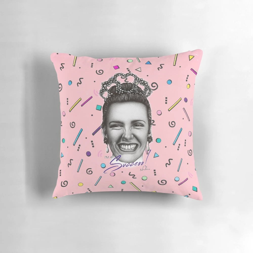 Colorful "I'm a Success!" pillow with retro pop art design, featuring characters from classic 90s Australian films.