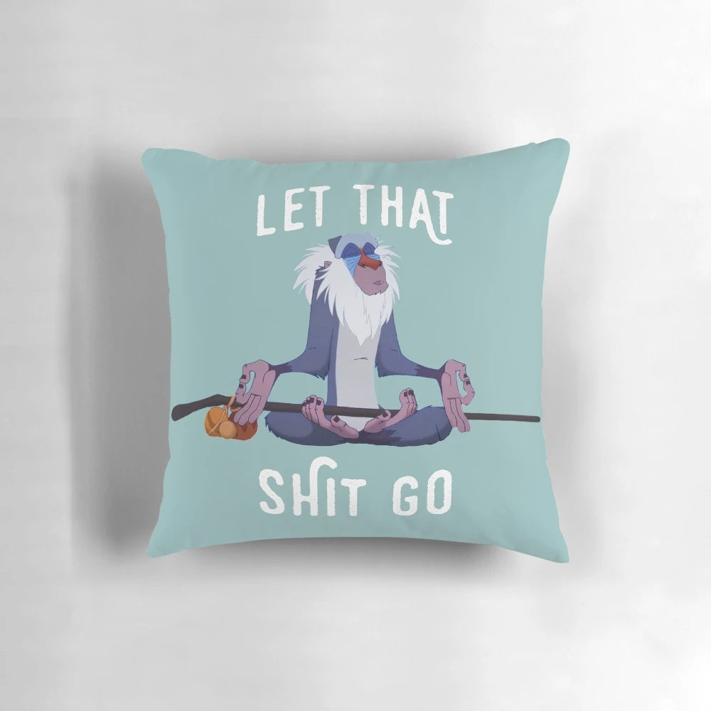 Inspirational pillow with "Let That Shit Go" quote and peaceful design