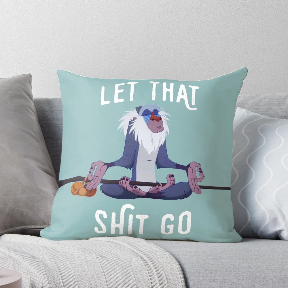 Inspirational pillow with "Let That Shit Go" quote and peaceful design