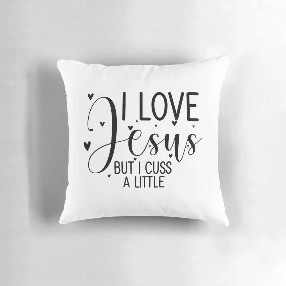Decorative throw pillow with the text "Love Jesus, but I cuss a little" in a stylish font
