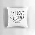 Decorative throw pillow with the text "Love Jesus, but I cuss a little" in a stylish font