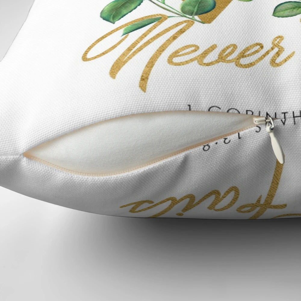 "Love Never Fails" throw pillow with floral and typography design