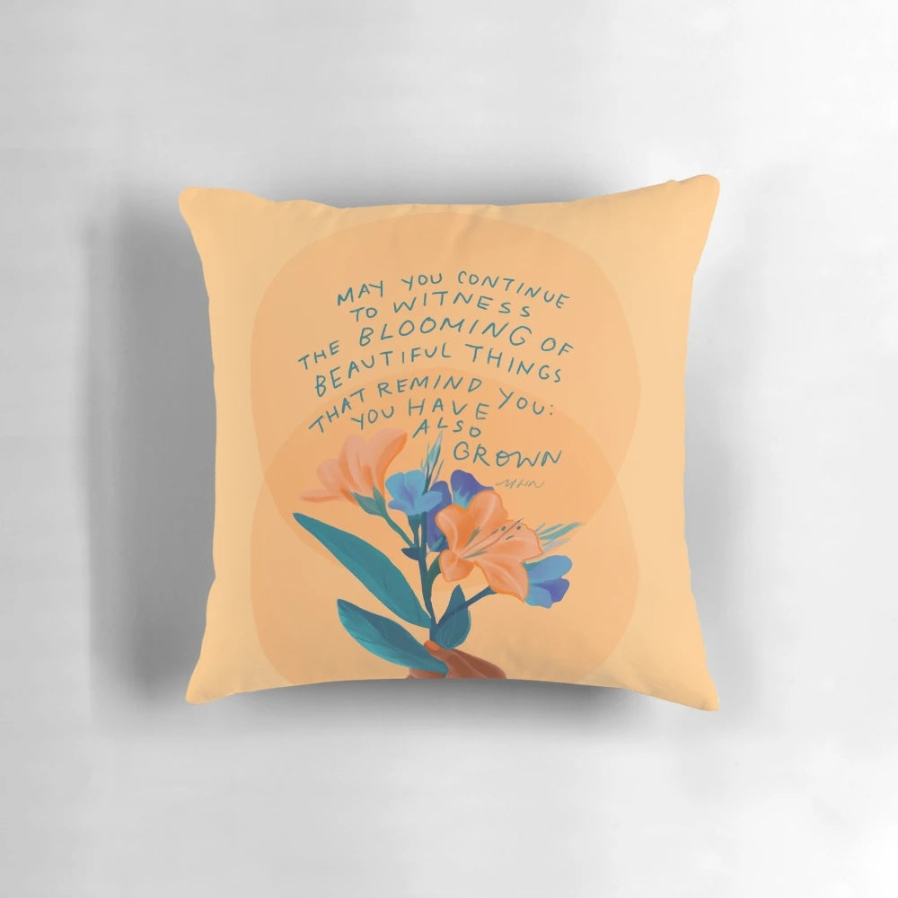 Inspirational and motivational yellow and blue floral pillow with a quote by Morgan Harper Nichols