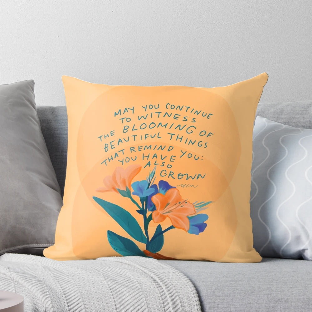 Inspirational and motivational yellow and blue floral pillow with a quote by Morgan Harper Nichols
