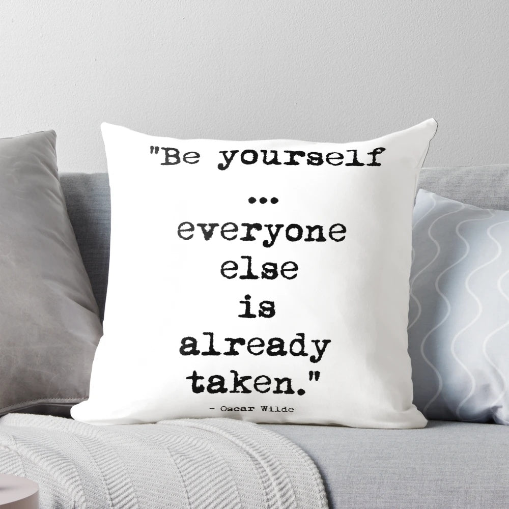 Decorative throw pillow featuring an inspiring quote by renowned Irish writer Oscar Wilde.