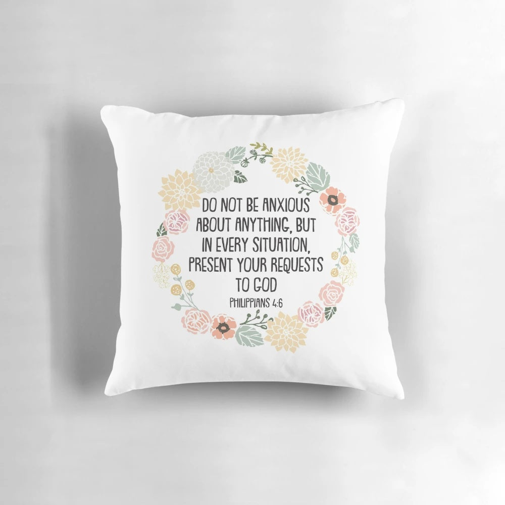 Philippians 4:6 Bible verse printed on a white decorative throw pillow