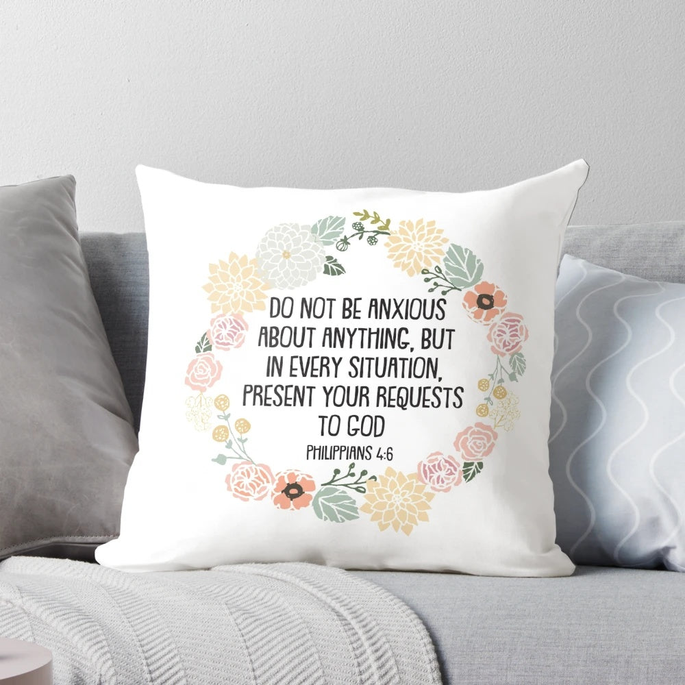 Philippians 4:6 Bible verse printed on a white decorative throw pillow