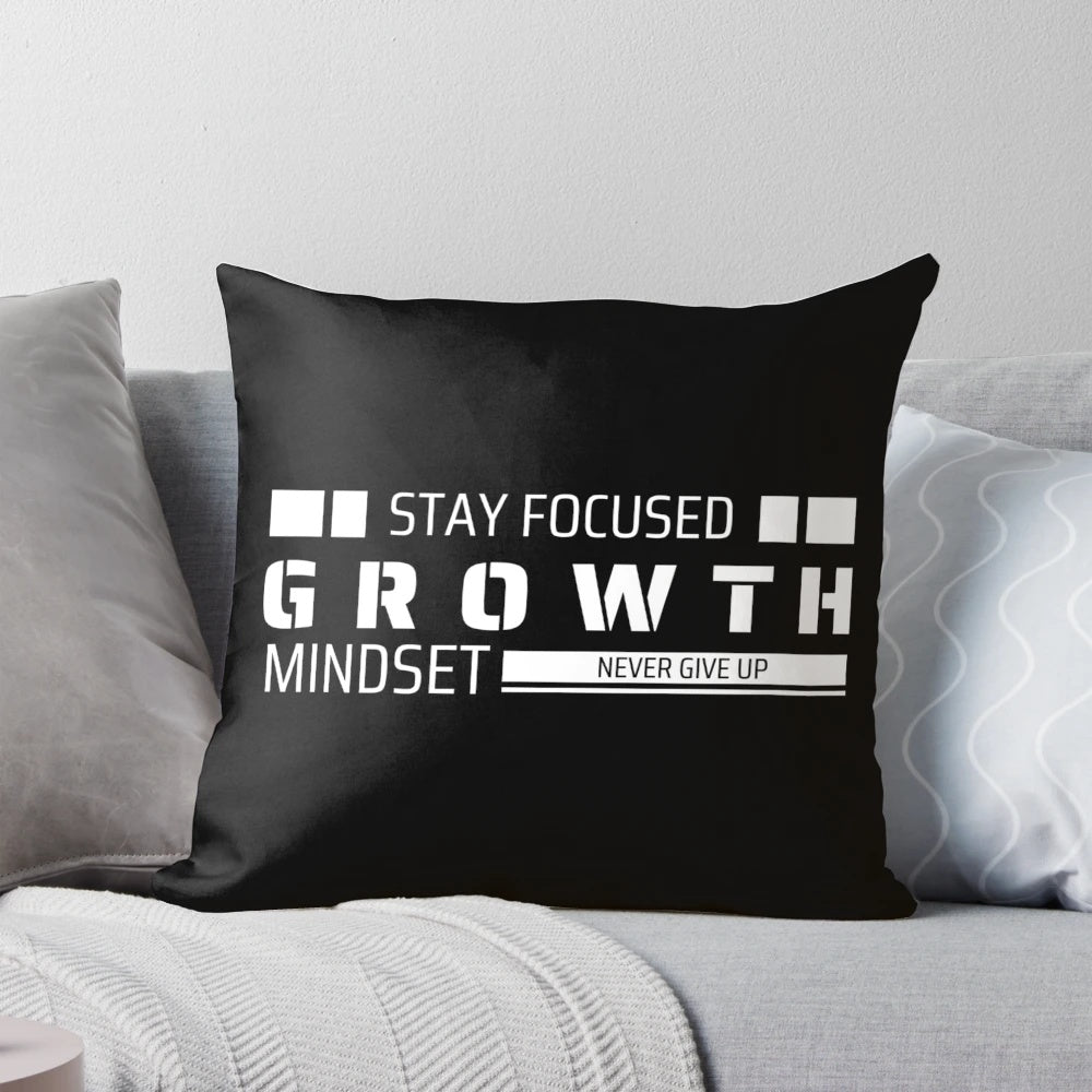Pillow with motivational "Stay Focused, Grow, Never Give Up" design
