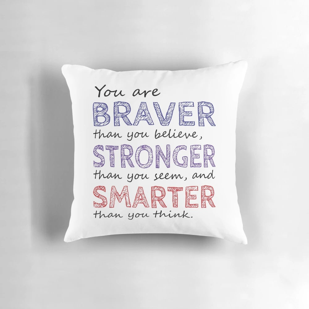 Inspirational pillow with the quote "You are braver than you believe, stronger than you seem, and smarter than you think