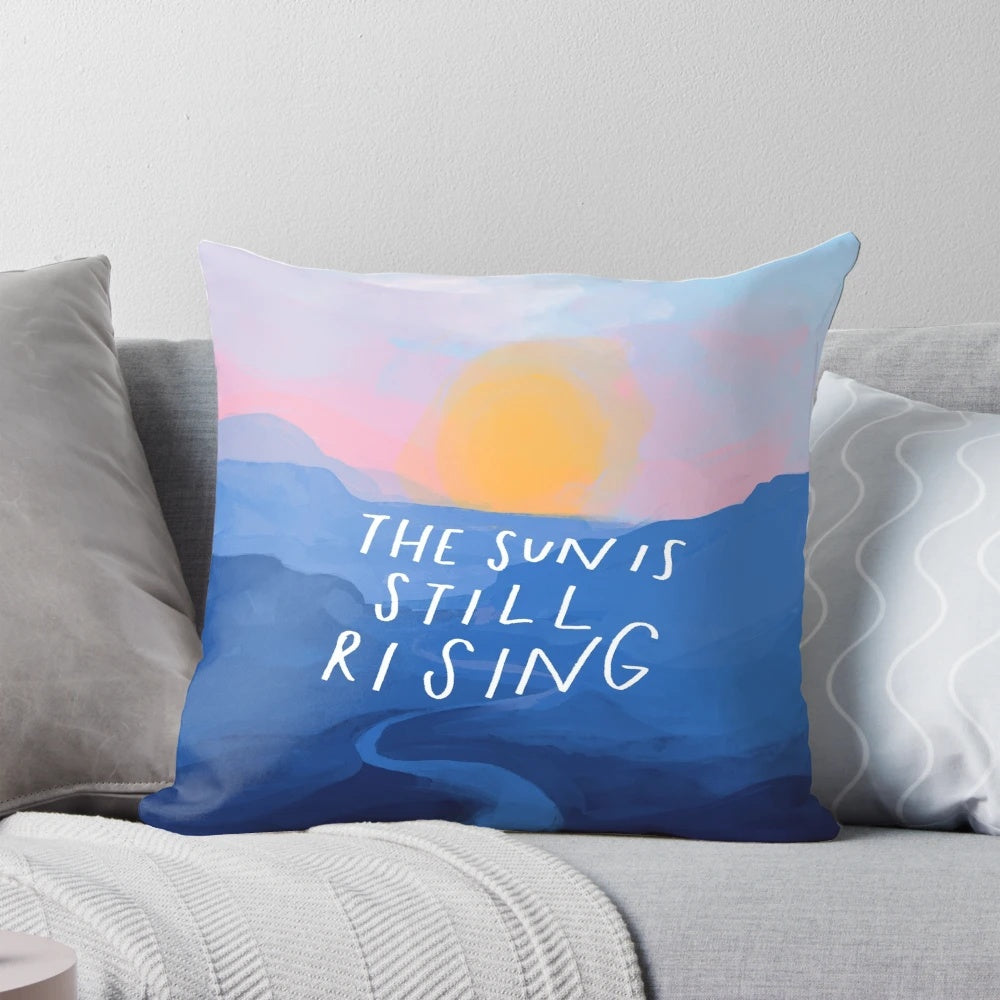 Pillow featuring an inspirational quote and abstract blue mountain sunrise landscape design, painted by Morgan Harper Nichols.