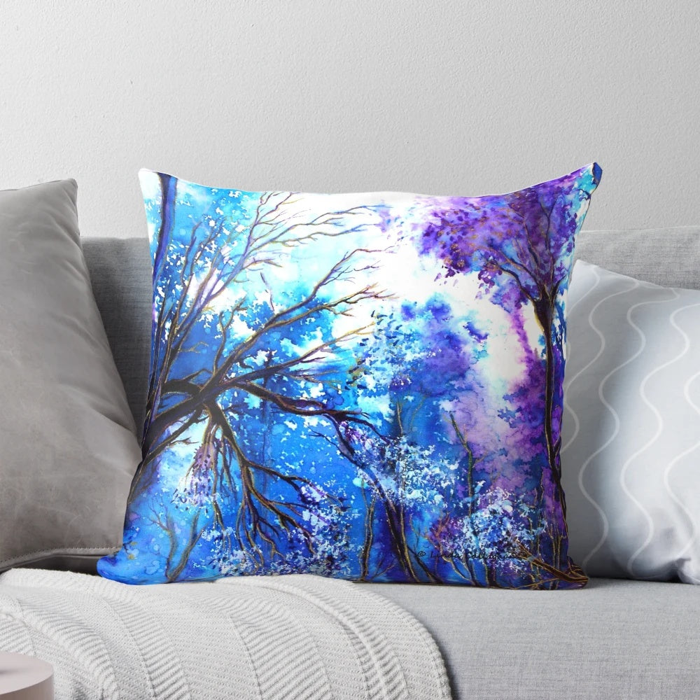A tranquil watercolor painting of a tree with the words "Ray of Hope" on a decorative pillow.