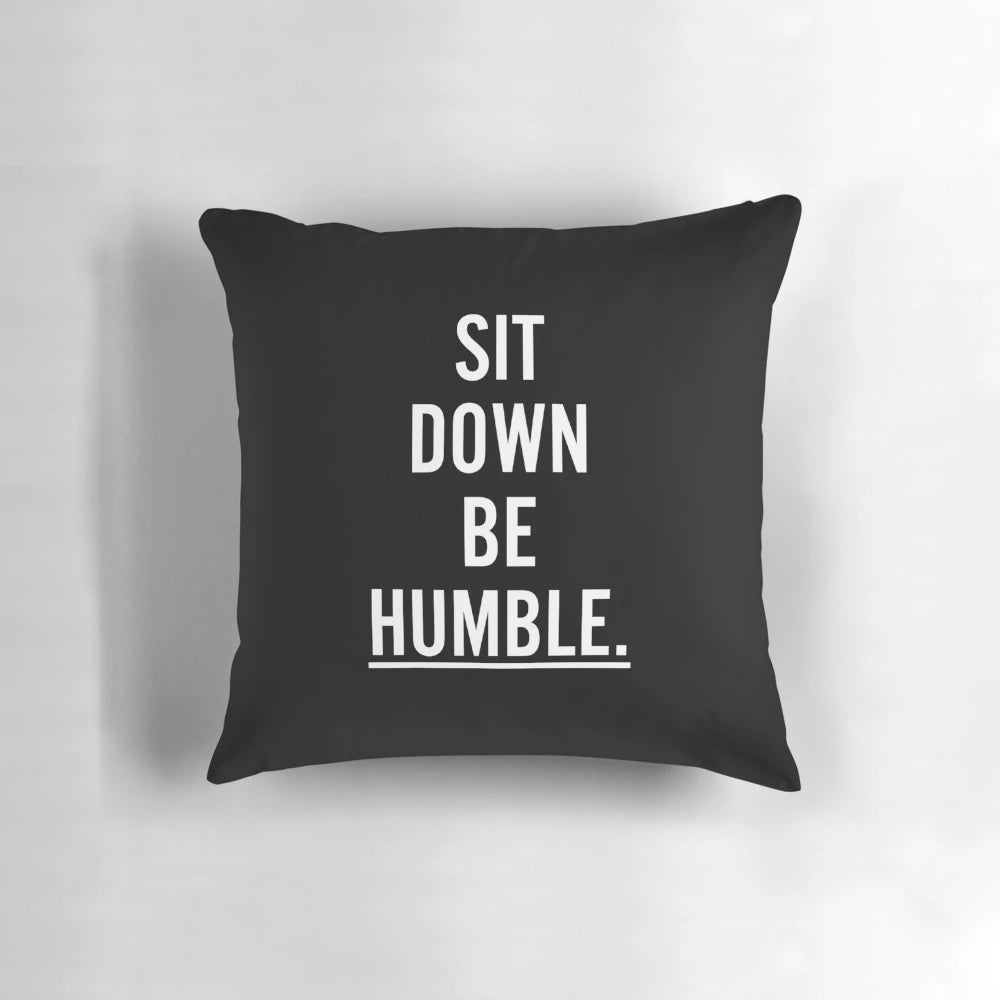 Throw pillow with the text "MUSIC : SIT DOWN BE HUMBLE"
