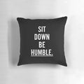 Throw pillow with the text "MUSIC : SIT DOWN BE HUMBLE"
