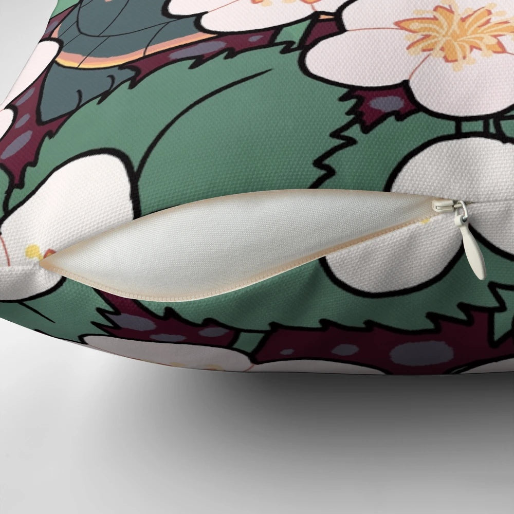 A soft, square pillow with an illustration of a baby turtle surrounded by strawberry flowers, with the text "Small Steps Still Count