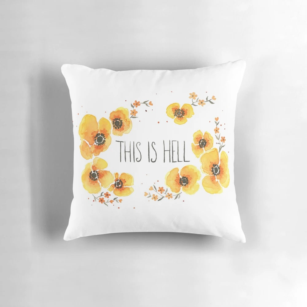 A vibrant, floral-inspired "This is Hell" throw pillow with a motivational quote.