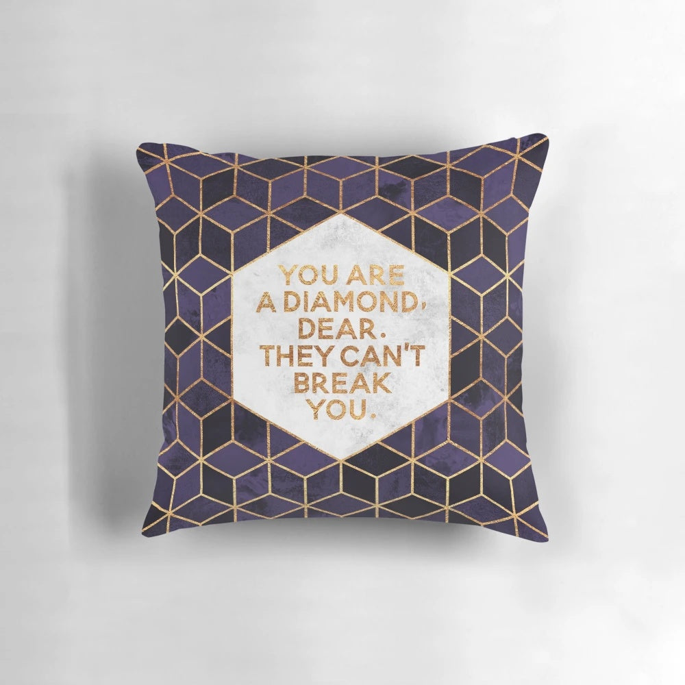 Decorative purple and geometric throw pillow with motivational quote "You are a diamond, dear.