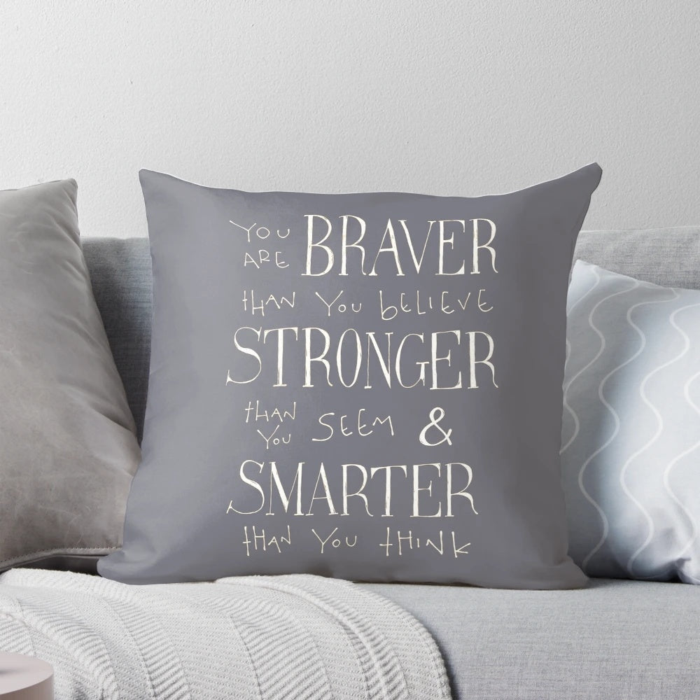 Monochrome hand-lettered pillow with motivational quote in a modern, minimalist style