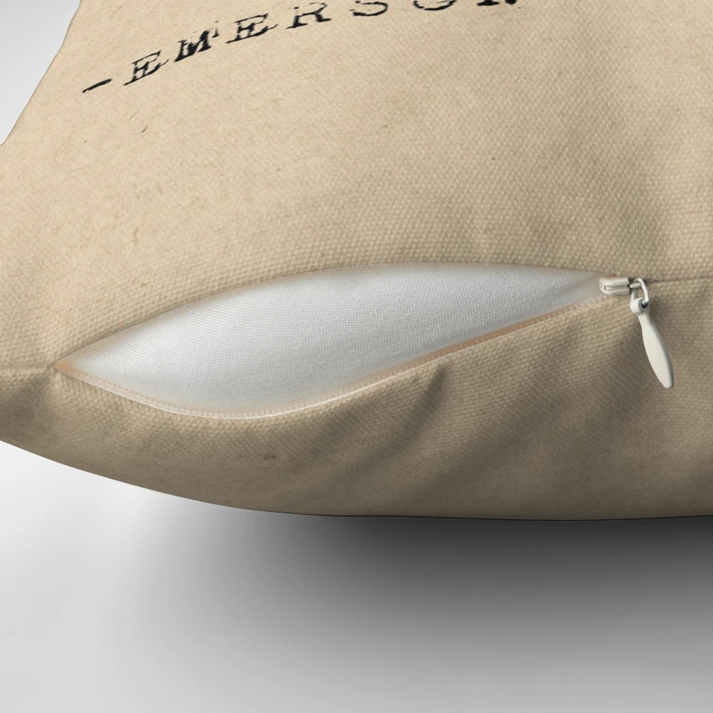 Pillow with inspirational typography quote "Live in the sunshine, swim in the sea, drink the wild air" in minimalist design