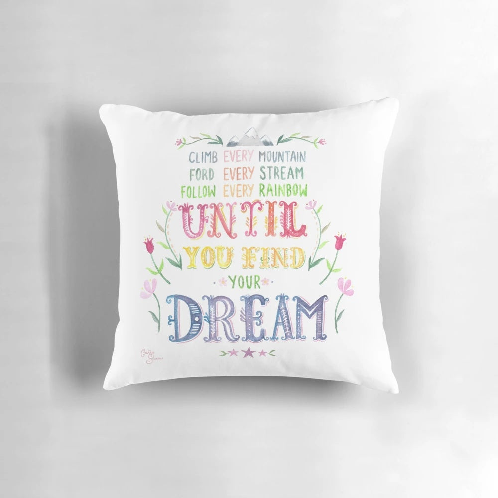 Colorful watercolor-style illustration of mountains and flowers with the words "Climb Every Mountain" on a soft, plush throw pillow.