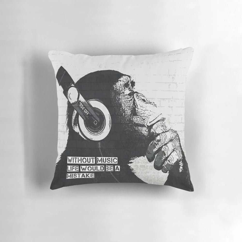 Decorative throw pillow featuring a Banksy-inspired "Without Music Life Would Be A Mistake" street art design
