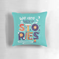 Decorative throw pillow with hand lettered inspirational quote "We Are Made of Stories