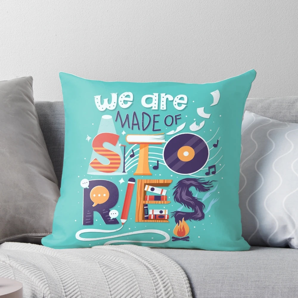 Decorative throw pillow with hand lettered inspirational quote "We Are Made of Stories