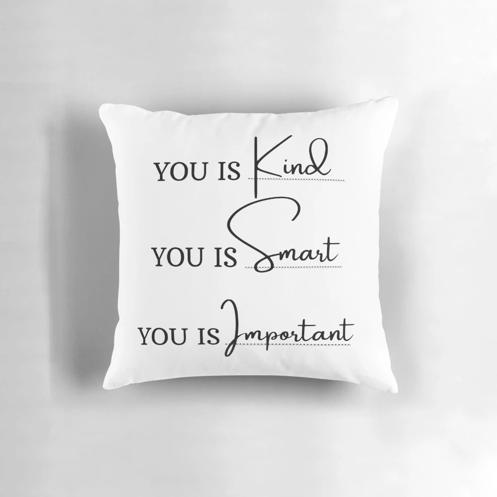 Soft, plush pillow with the inspirational movie quote "You is kind, you is smart, you is important" in white text on a turquoise background.