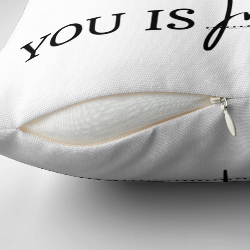 Soft, plush pillow with the inspirational movie quote "You is kind, you is smart, you is important" in white text on a turquoise background.