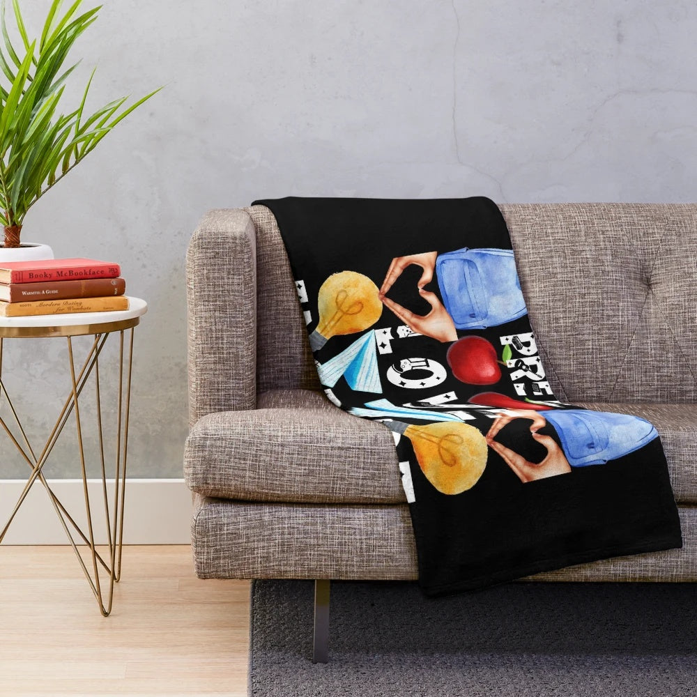 Plush blanket with "teach love inspire" text, ideal for pre-K teachers and education professionals.