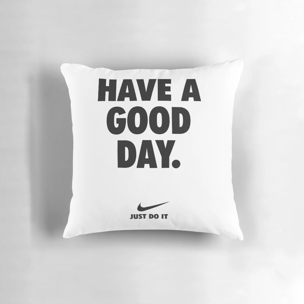 A blue and white Nike pillow with a motivational phrase, perfect for home decor and wall art.
