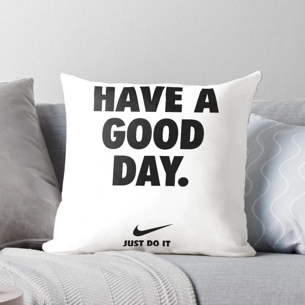 A blue and white Nike pillow with a motivational phrase, perfect for home decor and wall art.