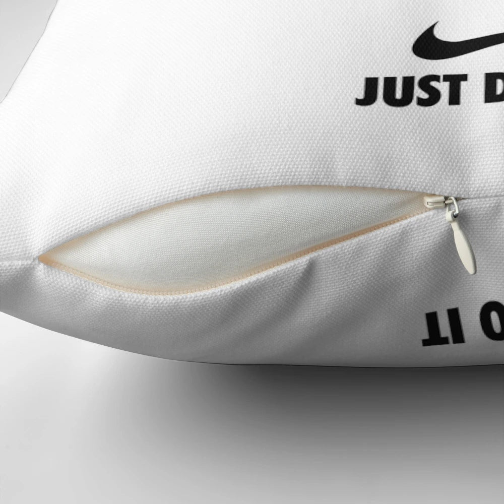 A blue and white Nike pillow with a motivational phrase, perfect for home decor and wall art.